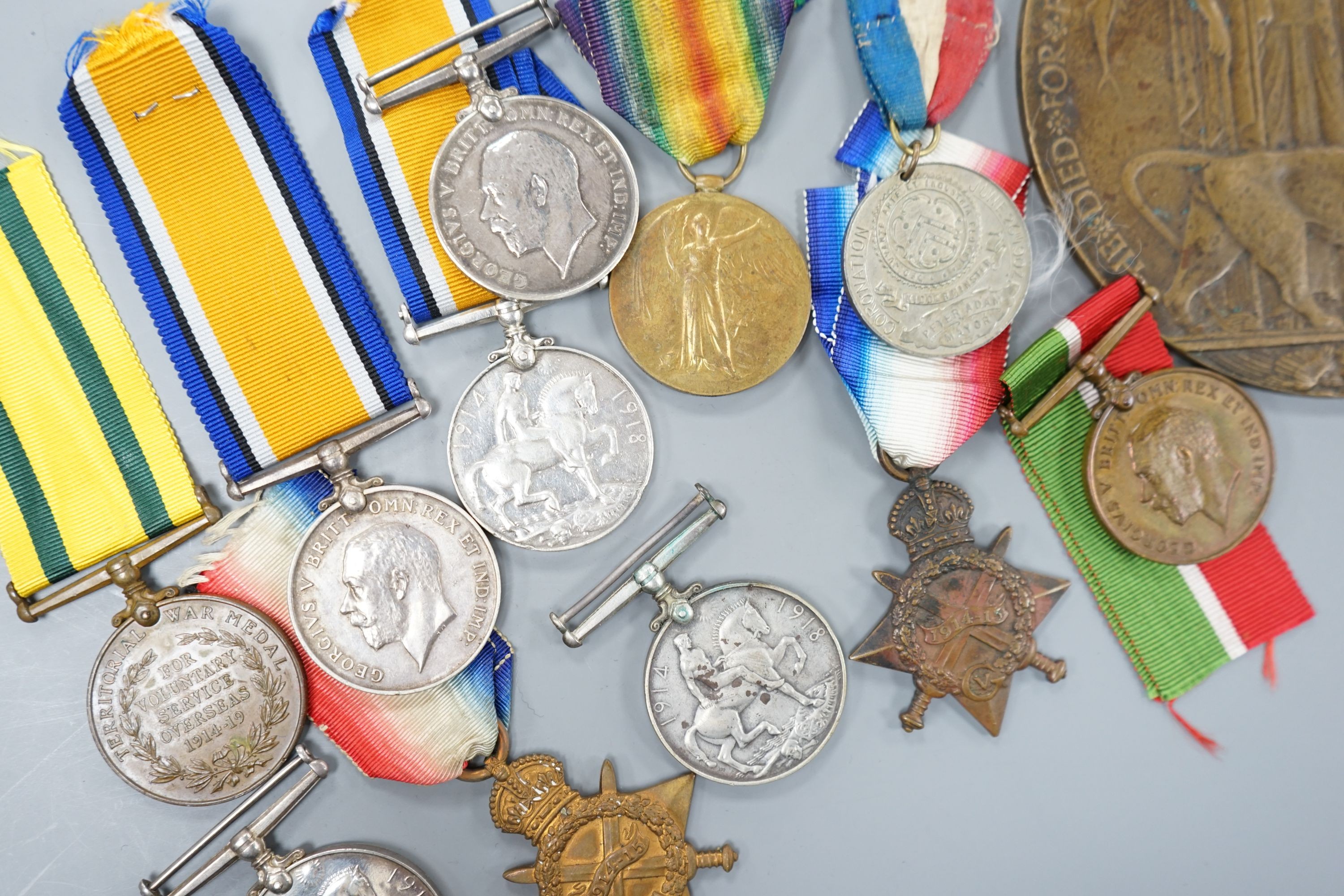 A collection of of odd WW1 medals to different recipients and a bronze death plaque to Shah Khan